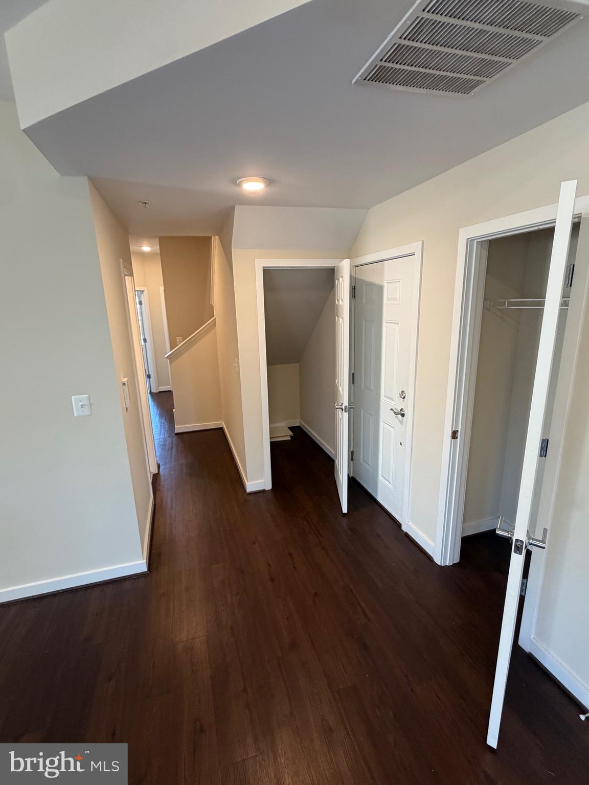 3303 Demirel Way, Unit D Ellicott City, MD 21042 - Photo 12 of 34 an empty room with wooden floor and a ceiling fan