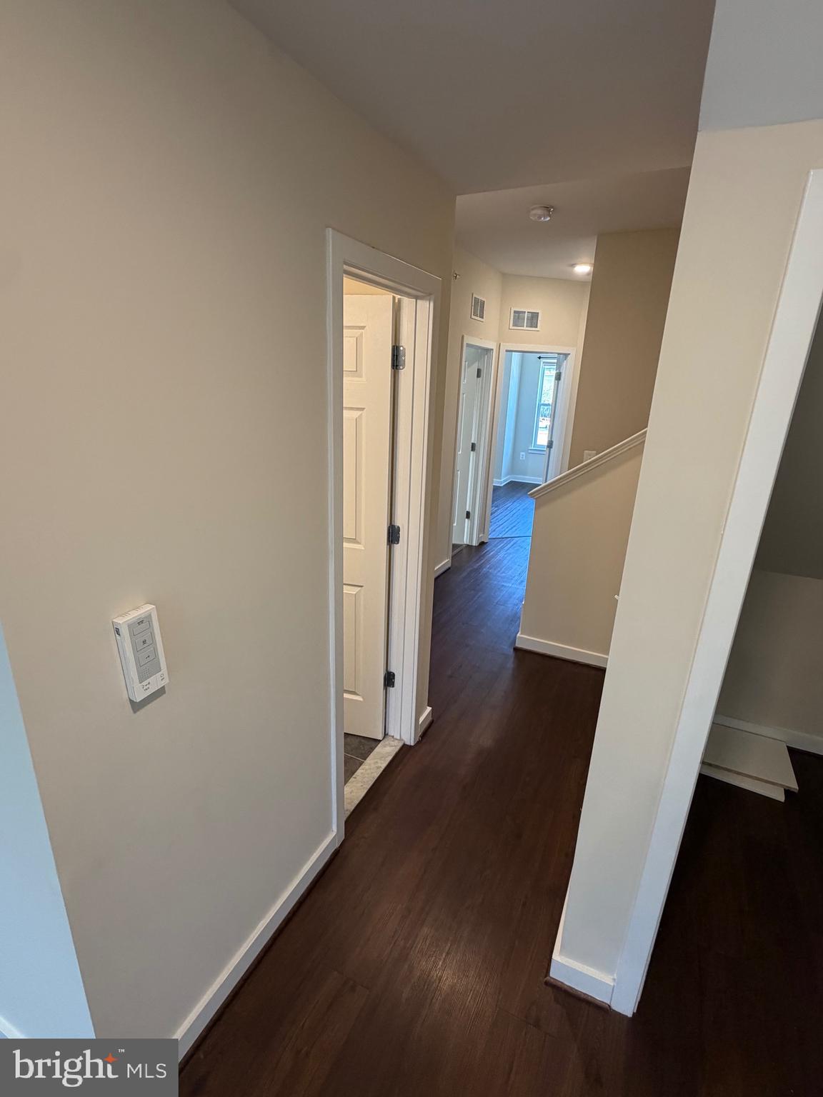 3303 Demirel Way, Unit D Ellicott City, MD 21042 - Photo 13 of 34 a view of a hallway with wooden floor