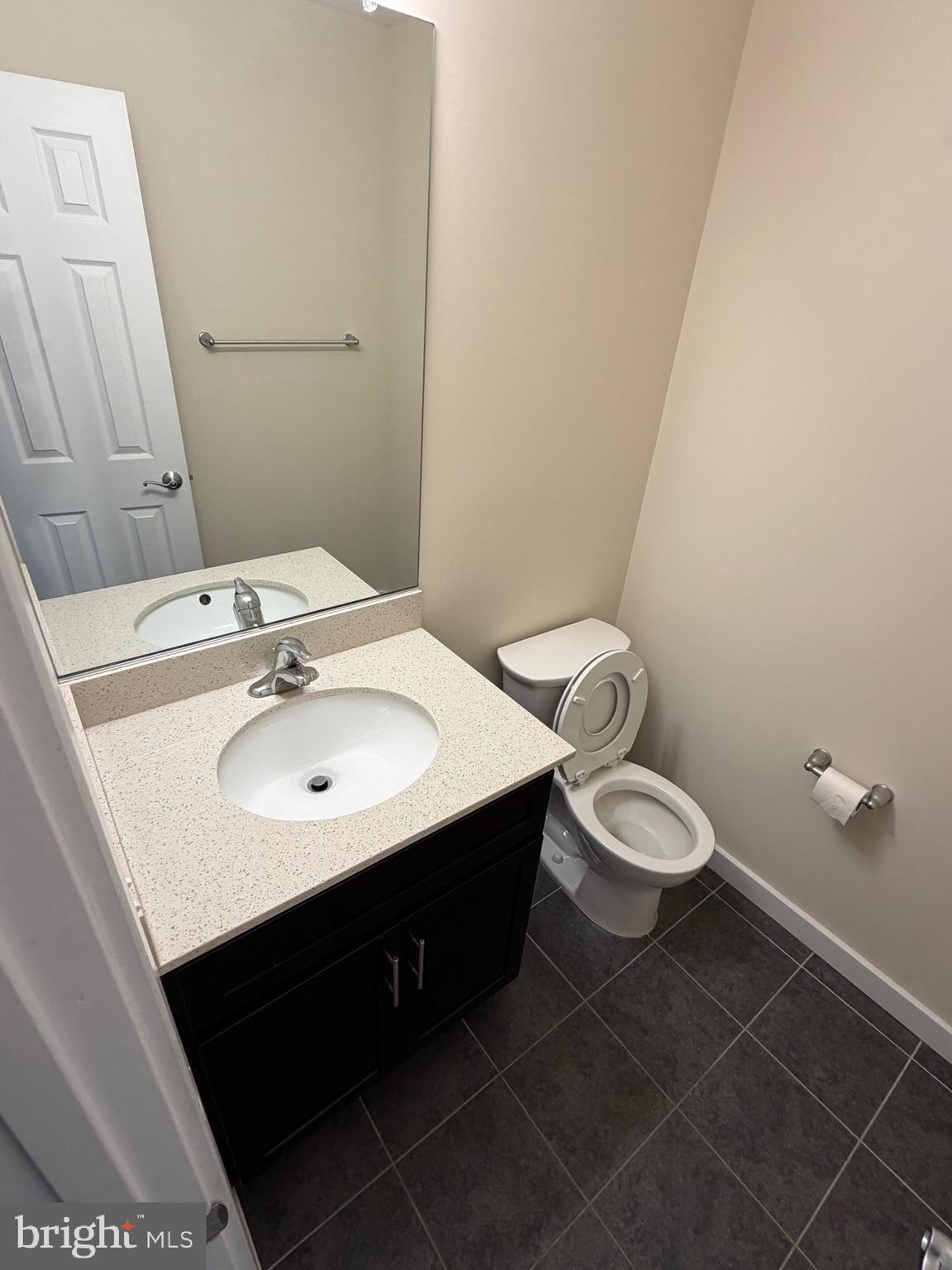 3303 Demirel Way, Unit D Ellicott City, MD 21042 - Photo 15 of 34 a bathroom with a sink toilet and a mirror