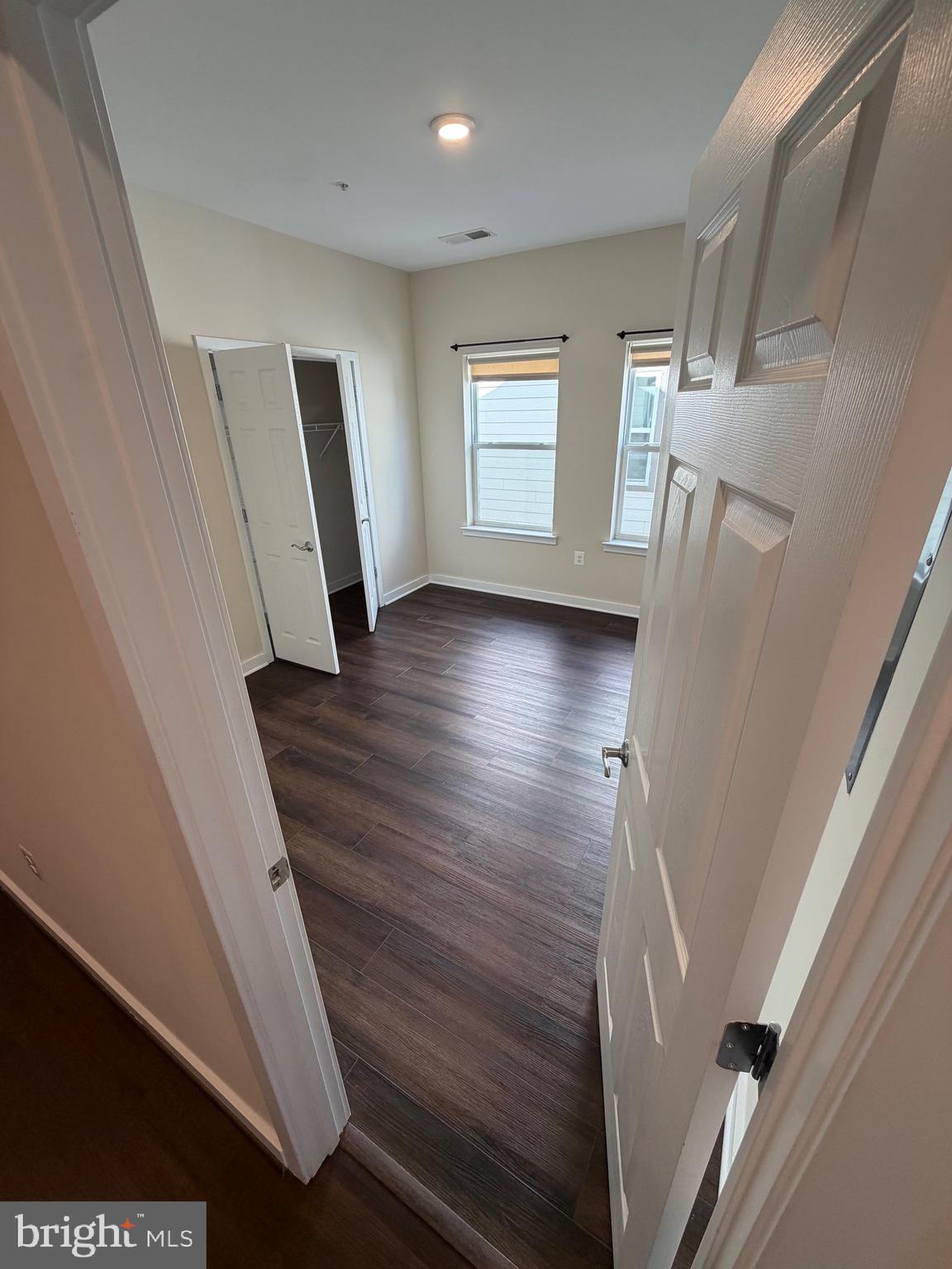3303 Demirel Way, Unit D Ellicott City, MD 21042 - Photo 18 of 34 a view of a livingroom with wooden floor and staircase