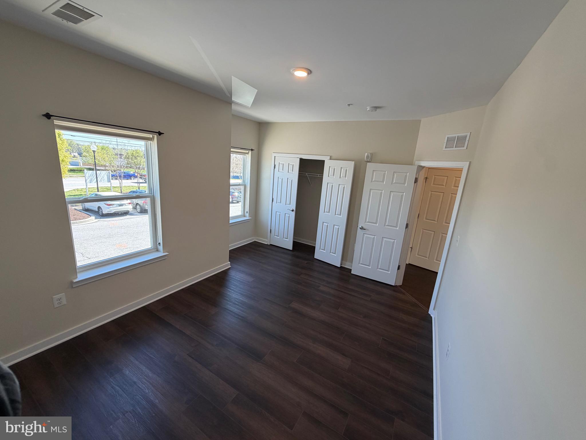 3303 Demirel Way, Unit D Ellicott City, MD 21042 - Photo 23 of 34 a view of a livingroom with wooden floor and window
