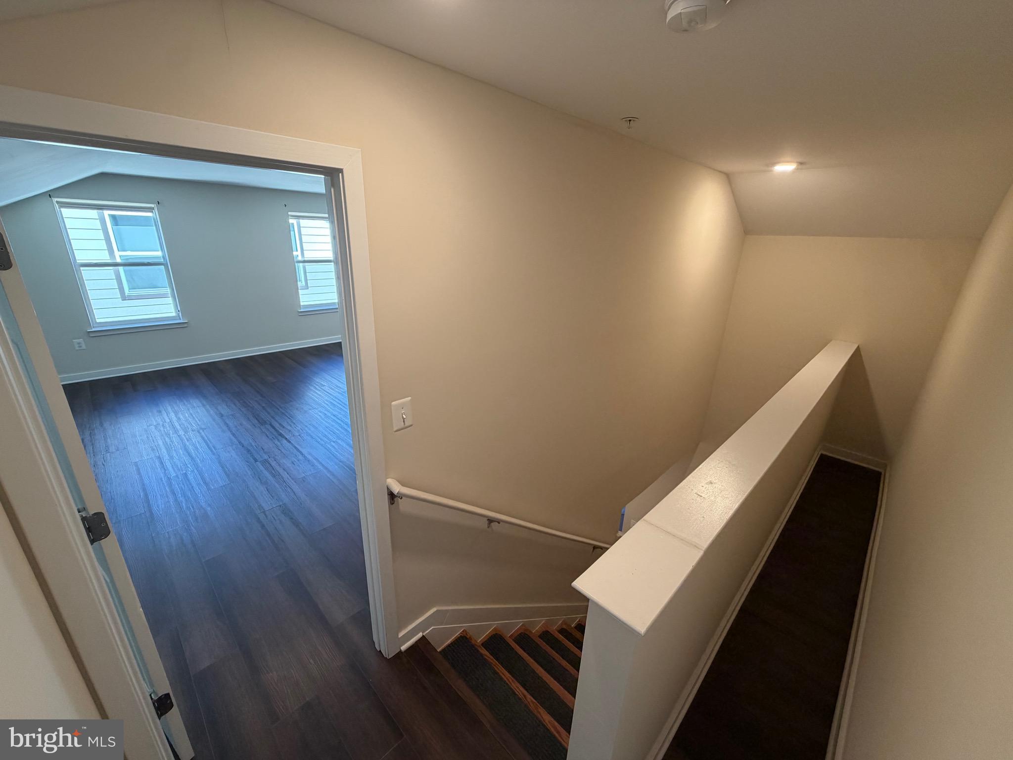 3303 Demirel Way, Unit D Ellicott City, MD 21042 - Photo 28 of 34 a view of an empty room with wooden floor and a window
