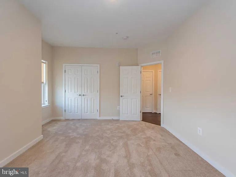 3303 Demirel Way, Unit D Ellicott City, MD 21042 - Photo 7 of 12 a view of an empty room