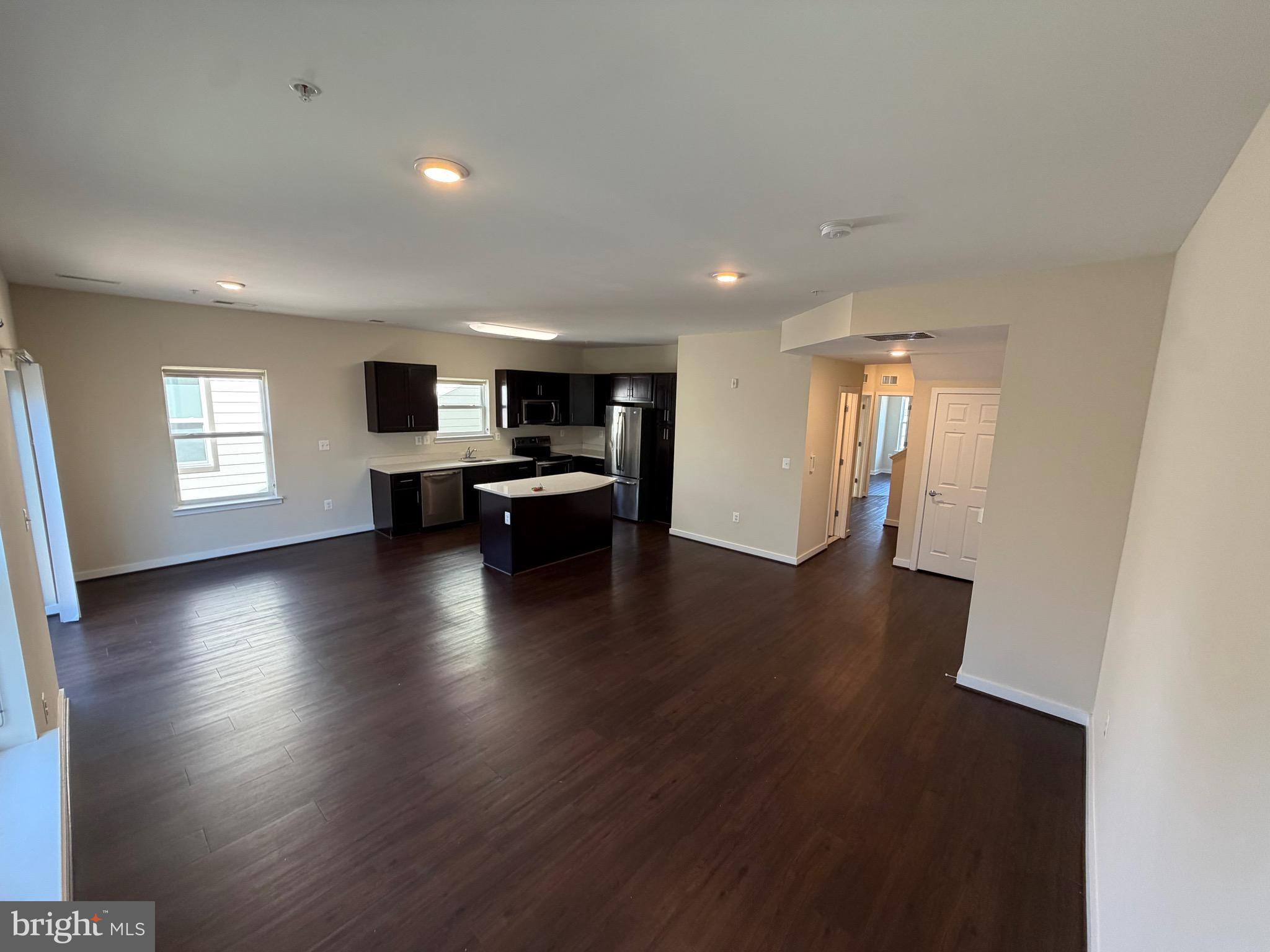 3303 Demirel Way, Unit D Ellicott City, MD 21042 - Photo 8 of 34 a view of kitchen with livingroom and hardwood floor