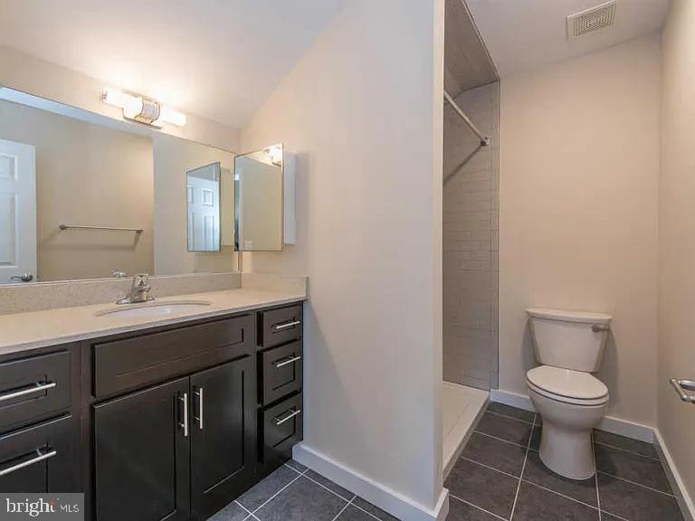 3303 Demirel Way, Unit D Ellicott City, MD 21042 - Photo 9 of 12 a bathroom with a toilet sink and mirror