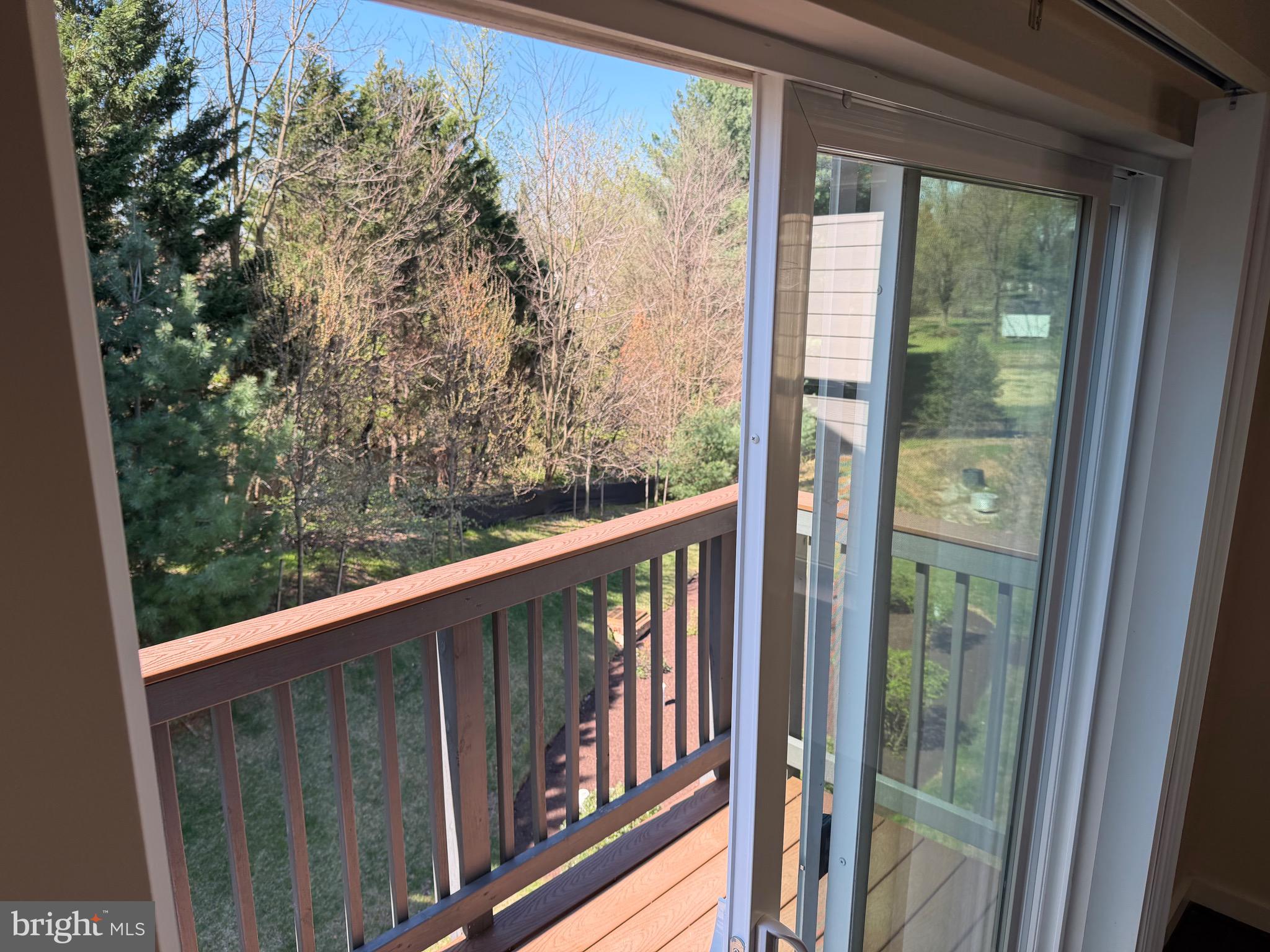 3303 Demirel Way, Unit D Ellicott City, MD 21042 - Photo 10 of 34 a view of a balcony with wooden floor