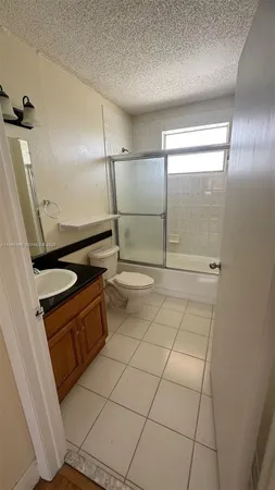 a bathroom with a sink and a shower