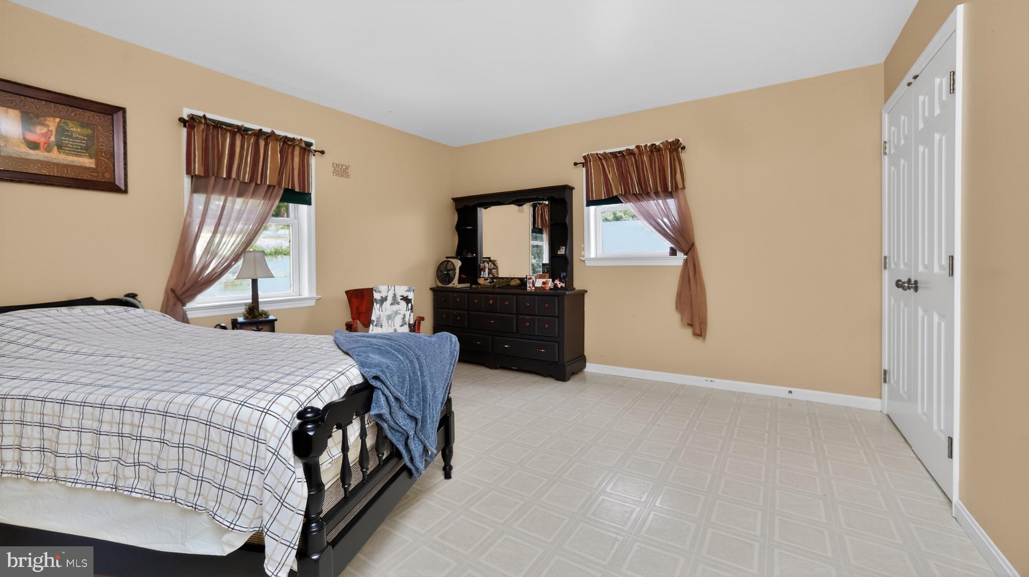 257 Hill Road New Holland, PA 17557 - Photo 66 of 94 Spacious bedroom with warm tones.