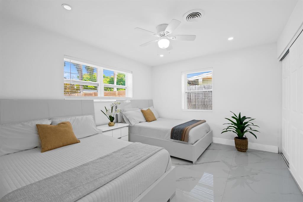 865 Northeast 23rd Terrace Pompano Beach, FL 33062 - Photo 20 of 33 a living room with furniture and a large window