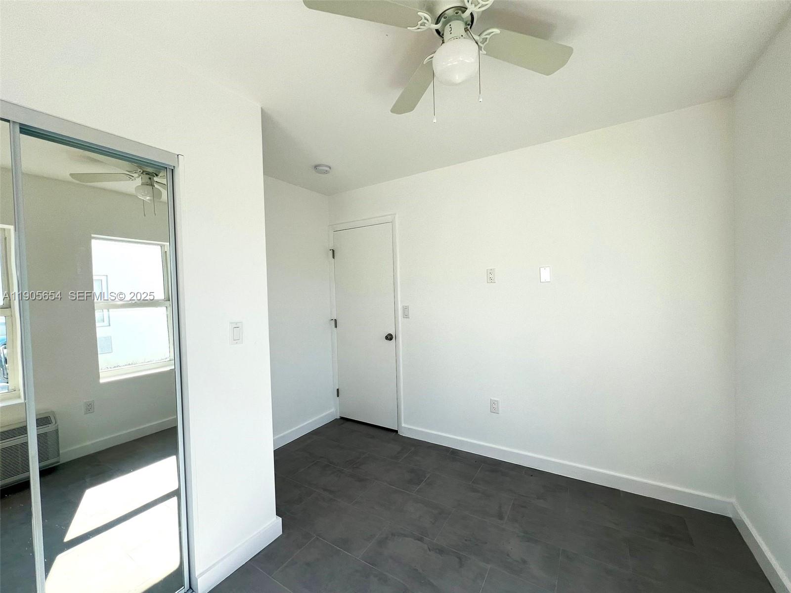 1541 Northwest 1st Place, Unit 4 Miami, FL 33136 - Photo 3 of 6 wooden floor in an empty room
