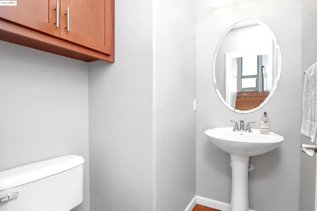a living room with dining room and wooden floor