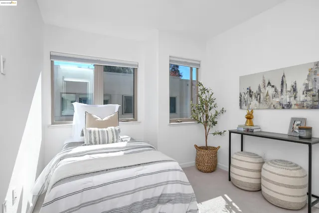 a view of a bedroom with bed and hallway