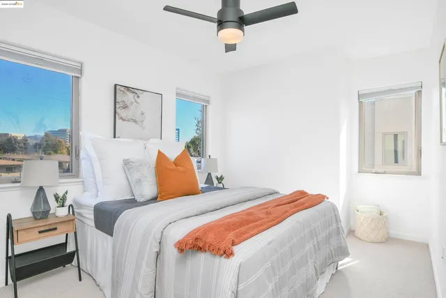 a bedroom with a bed and lamp