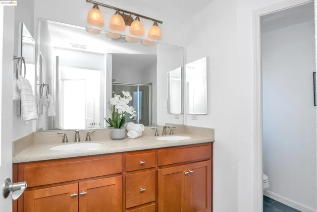 a bathroom with a glass door shower
