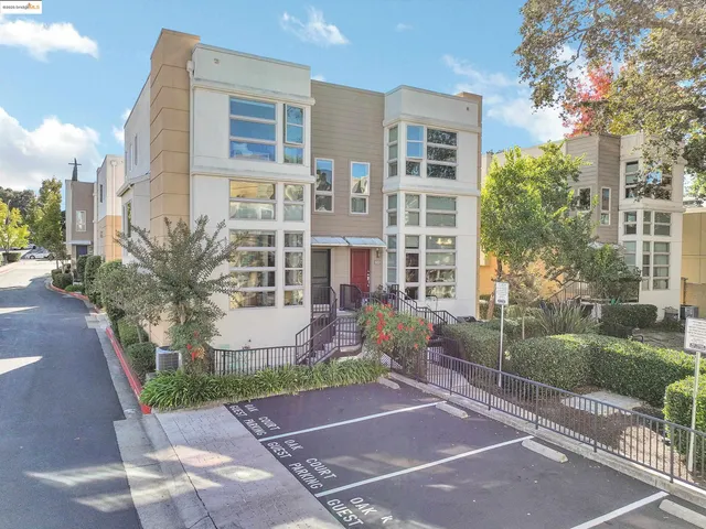 a view of a brick building next to a yard