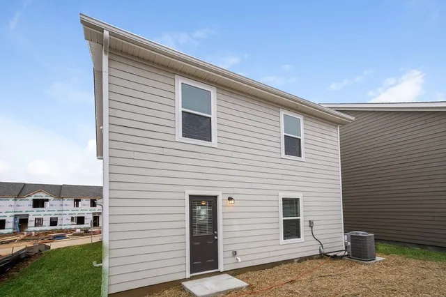 a view of a house with a backyard