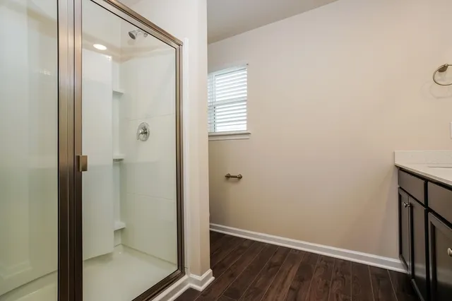 a bathroom with a shower and a toilet