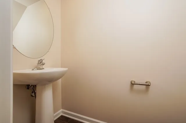 a bathroom with a sink and mirror
