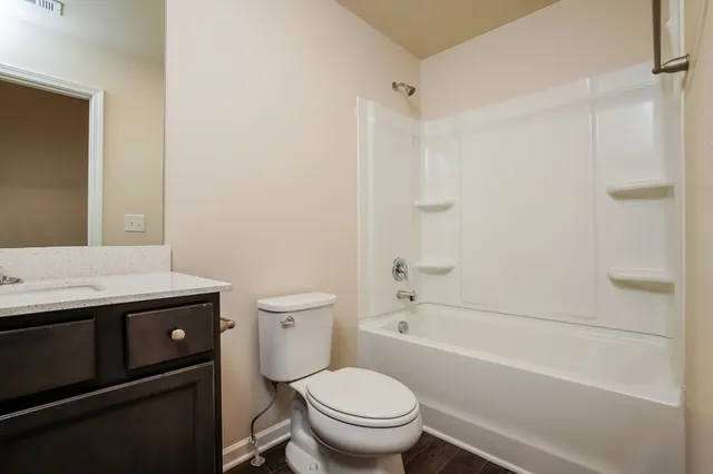 a bathroom with a sink a toilet and a bathtub