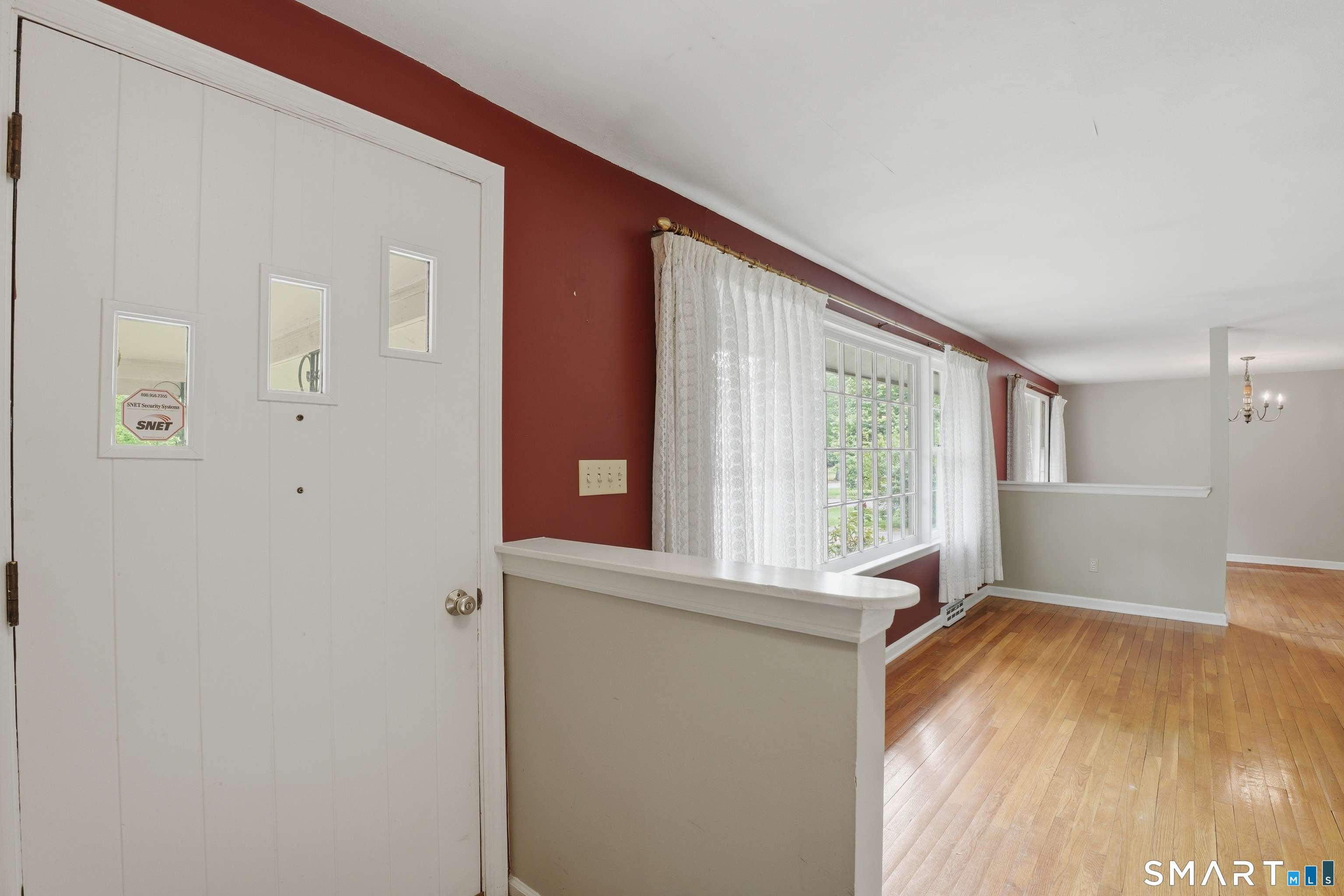 731 Still Hill Road Hamden, CT 06518 - Photo 4 of 40 a view of an empty room with wooden floor and a window