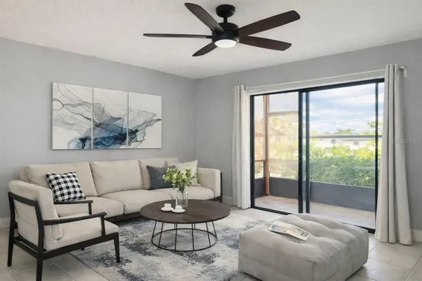 a living room with furniture and a large window
