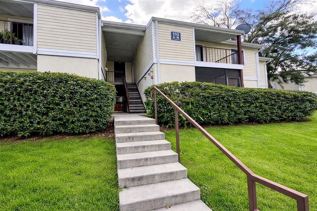310 Cherokee Court, Unit D Altamonte Springs, FL 32701 - Photo 3 of 22 a view of a house with backyard and plants