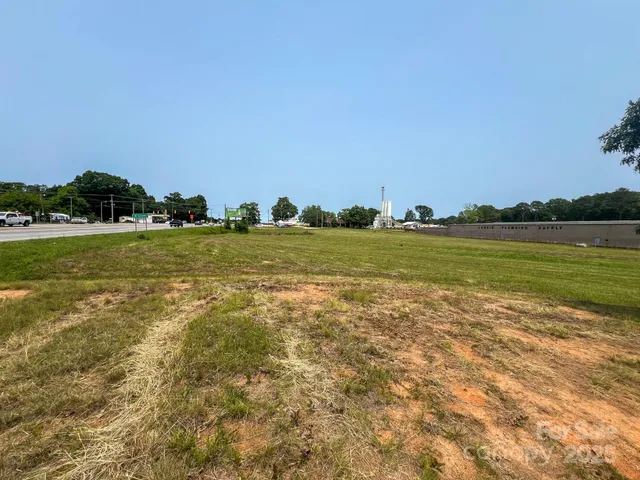 a view of a big room with an ocean and trees
