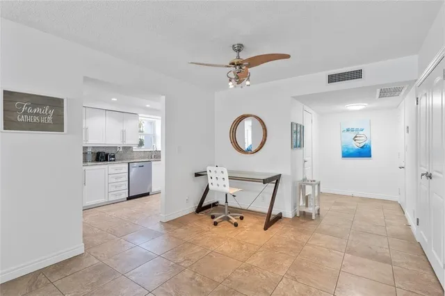 a living room with furniture and a clock