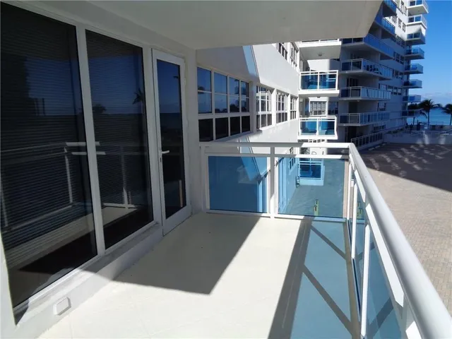 a kitchen with refrigerator and cabinets