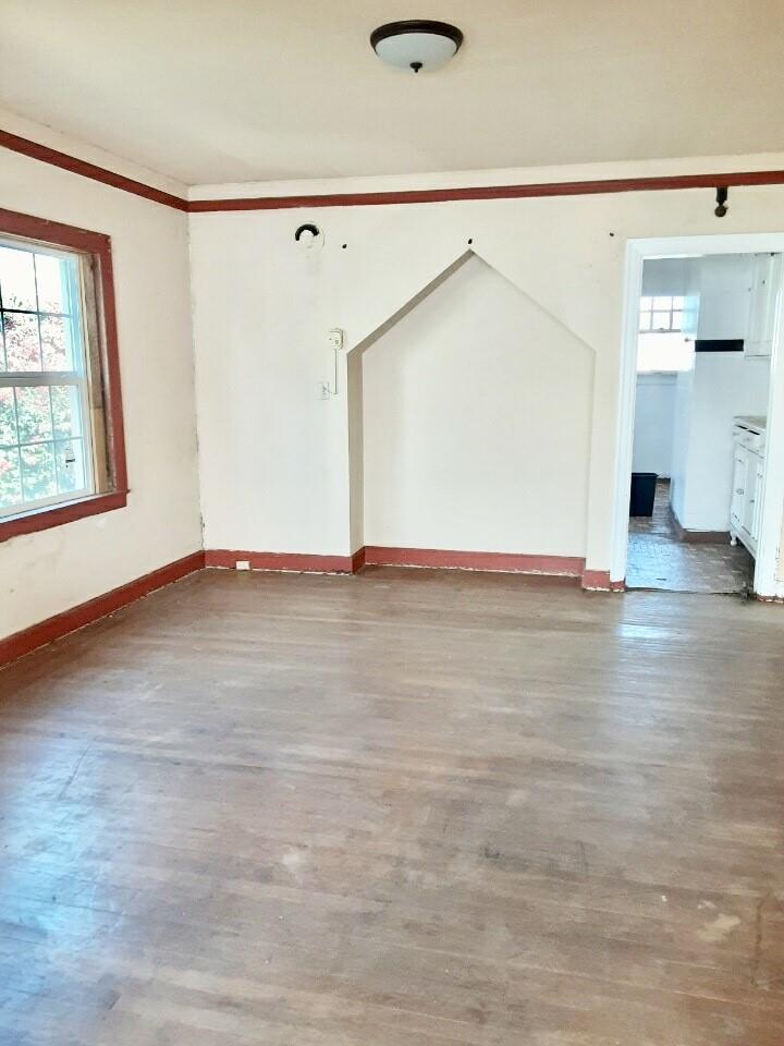 227 Winham Street Salinas, CA 93901 - Photo 2 of 5 a view of empty room with wooden floor and fan