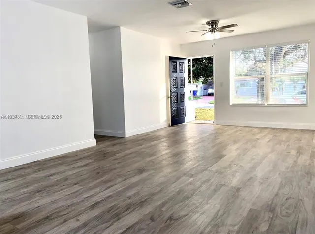 a view of an empty room with a window