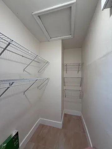 a view of a room with racks on the wall