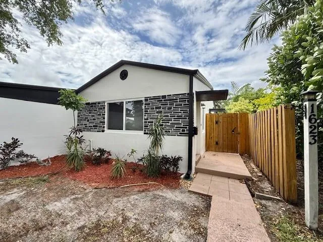 a house view with a garden space