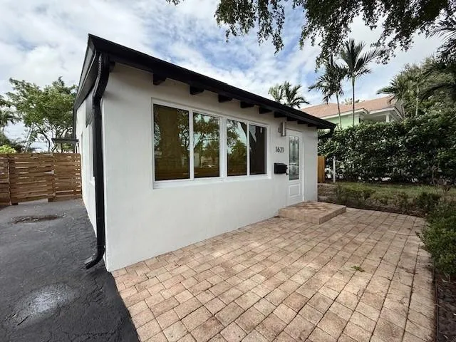 a house with trees in front of it