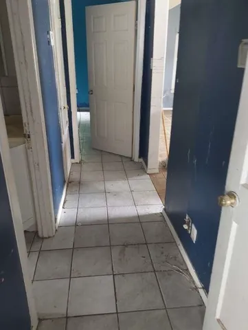 a view of empty room with windows