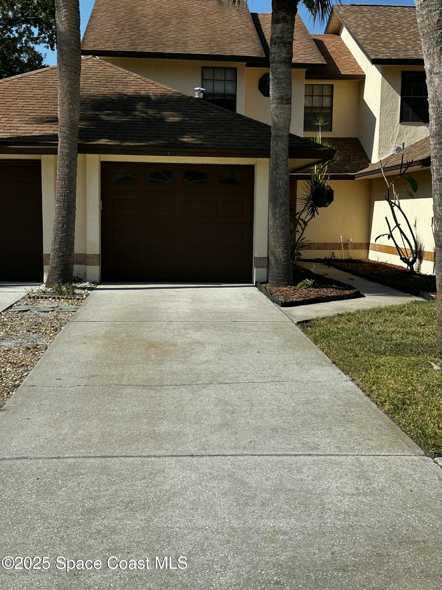 2710 Park Pl Boulevard, Unit 4 Melbourne, FL 32935 - Photo 11 of 16 a building with trees in front of it