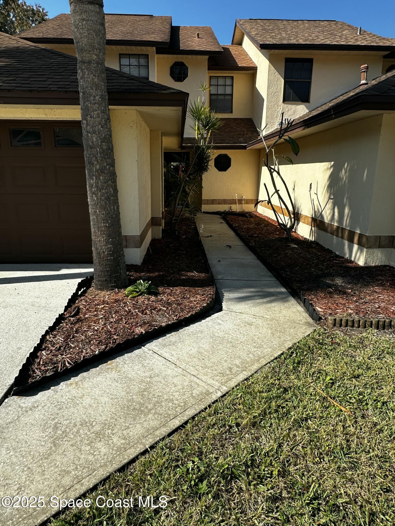 2710 Park Pl Boulevard, Unit 4 Melbourne, FL 32935 - Photo 2 of 16 a view of a house with a snow on the wall