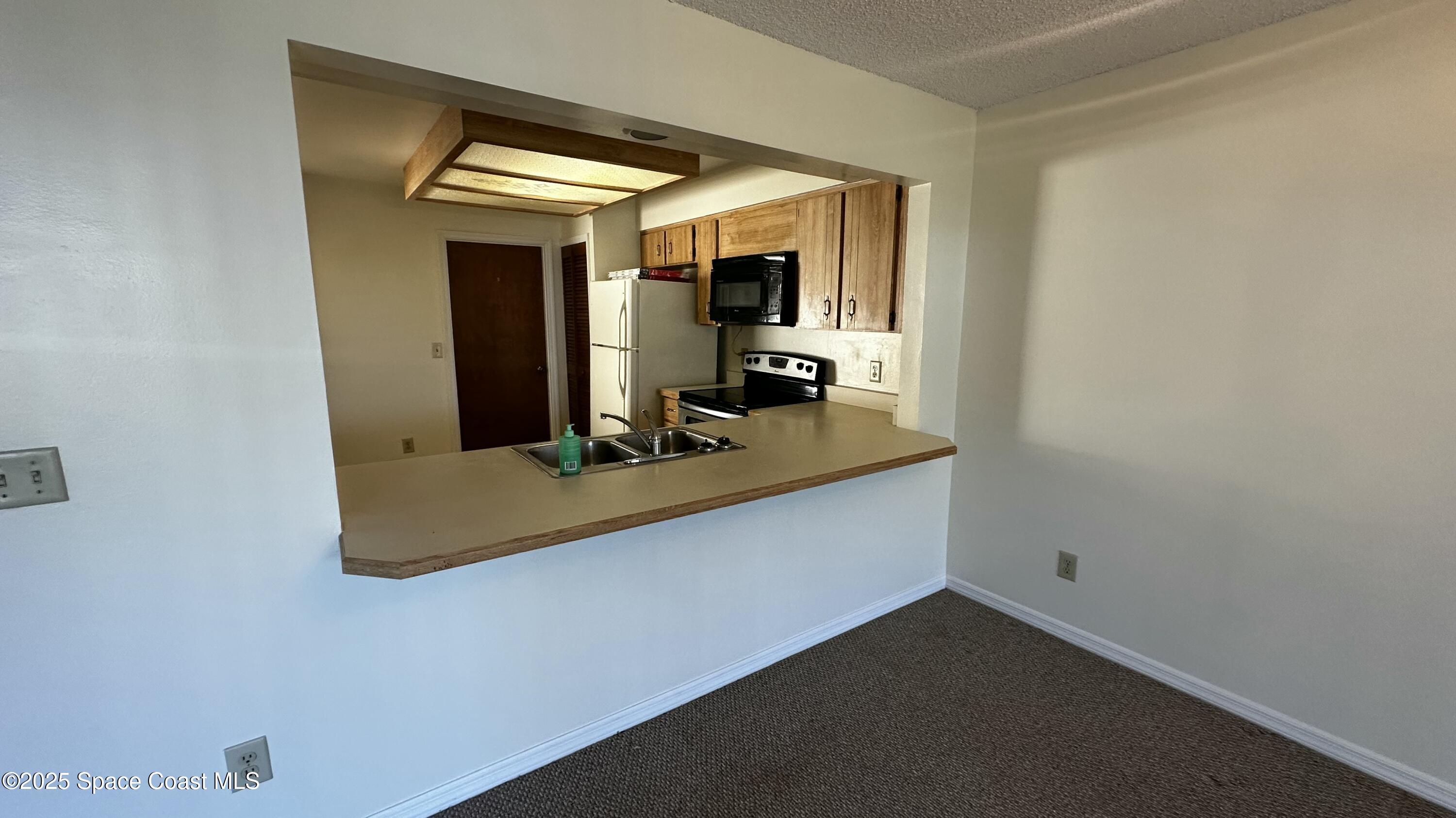 2710 Park Pl Boulevard, Unit 4 Melbourne, FL 32935 - Photo 3 of 16 a view of a room with gym equipment