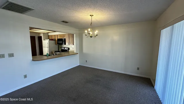 a view of a room with a chandelier