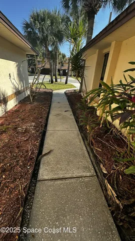 a view of a backyard of the house