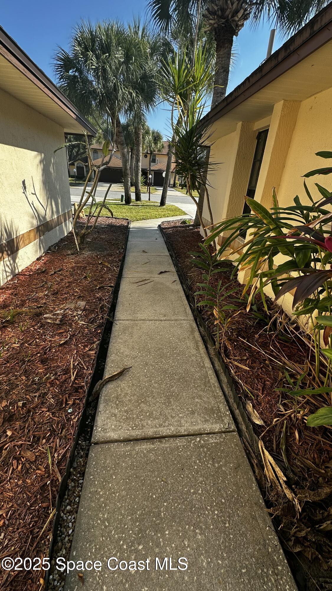 2710 Park Pl Boulevard, Unit 4 Melbourne, FL 32935 - Photo 10 of 16 a view of a backyard of the house