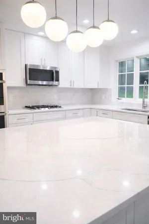 a view of a kitchen with a sink and a stove