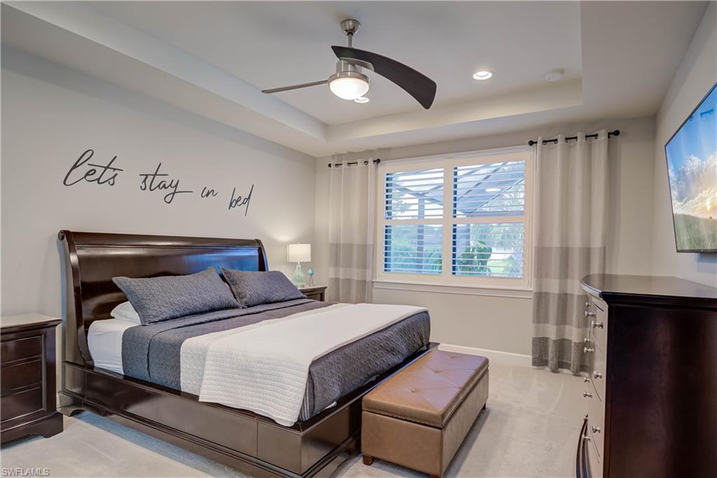 7938 Guadiana Way Ave Maria, FL 34142 - Photo 13 of 37 a bedroom with bed and window