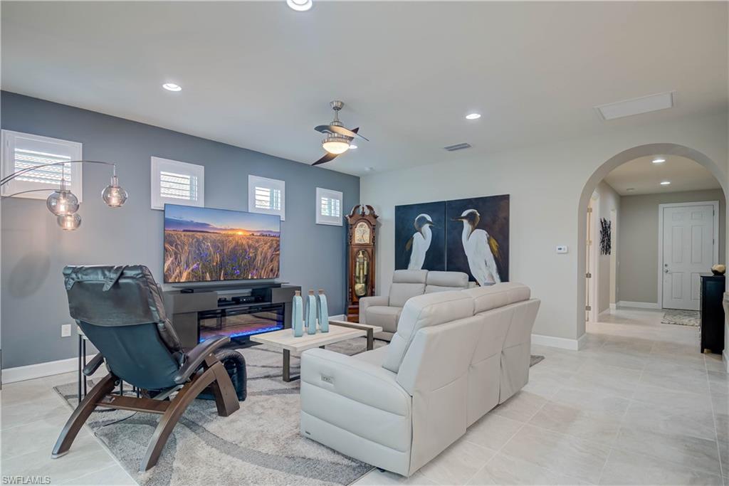7938 Guadiana Way Ave Maria, FL 34142 - Photo 19 of 37 a living room with furniture and a flat screen tv
