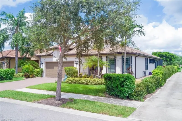 a house with a tree in front of it