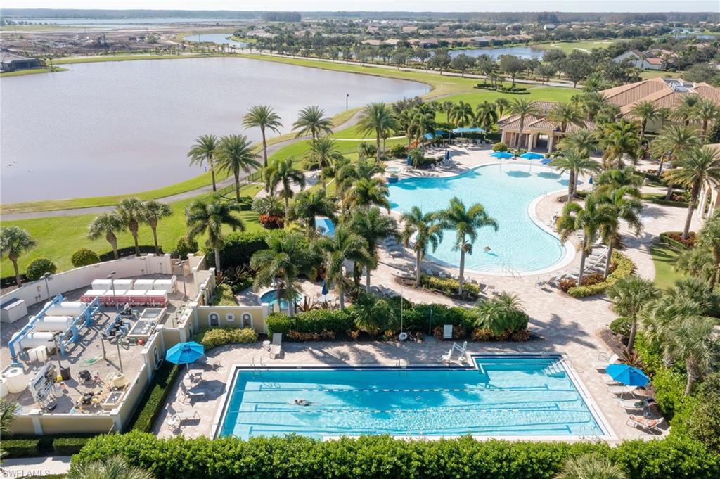 7938 Guadiana Way Ave Maria, FL 34142 - Photo 39 of 50 an aerial view of residential houses with outdoor space and lake view