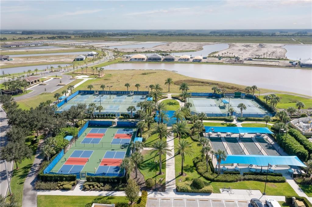 7938 Guadiana Way Ave Maria, FL 34142 - Photo 40 of 50 view of an outdoor space with swimming pool and ocean view