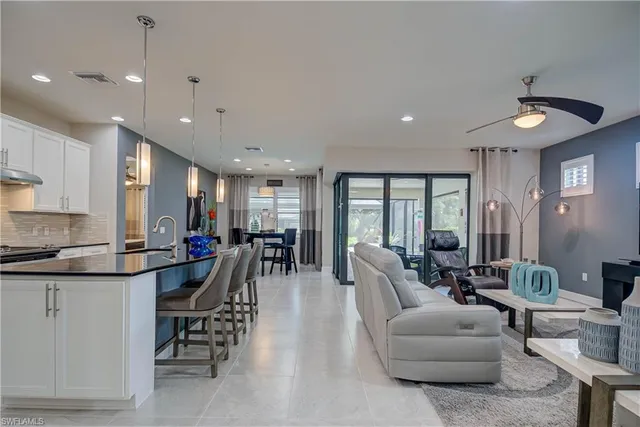 a very nice looking living room with furniture and a large window