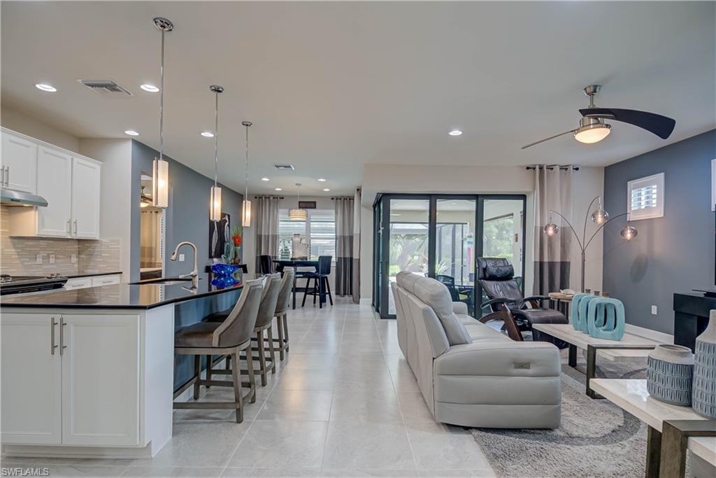 7938 Guadiana Way Ave Maria, FL 34142 - Photo 6 of 37 a very nice looking living room with furniture and a large window