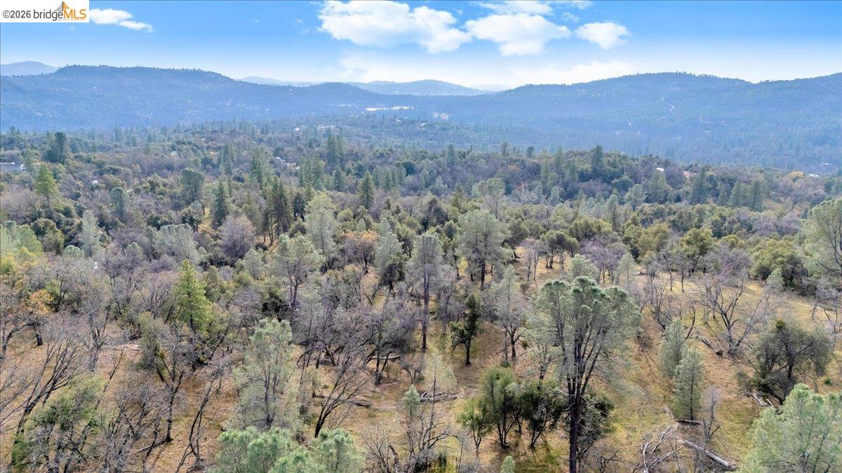 0 Montgomery Road Sonora, CA 95370 - Photo 17 of 31 a view of a lush green hillside and a building